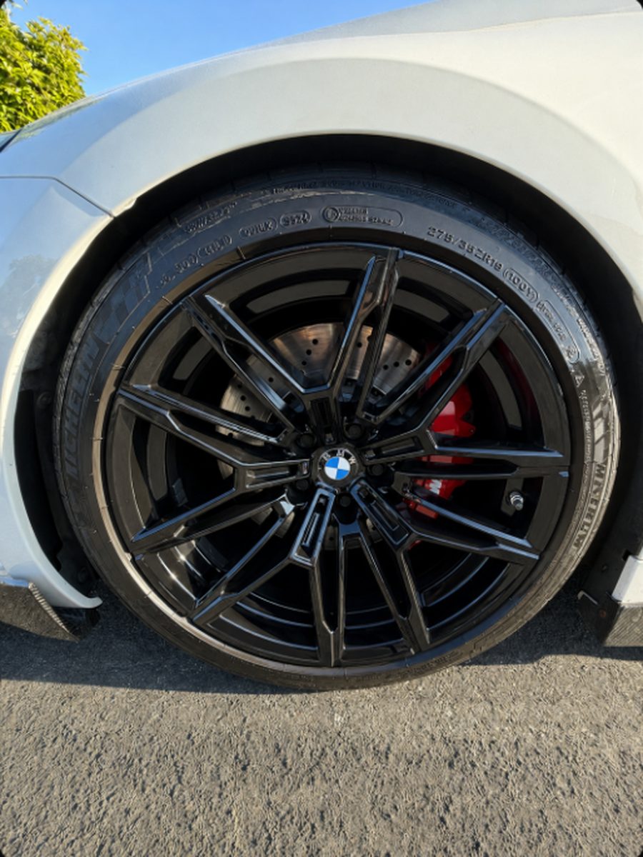 Wheel with red brake calipers after detailing